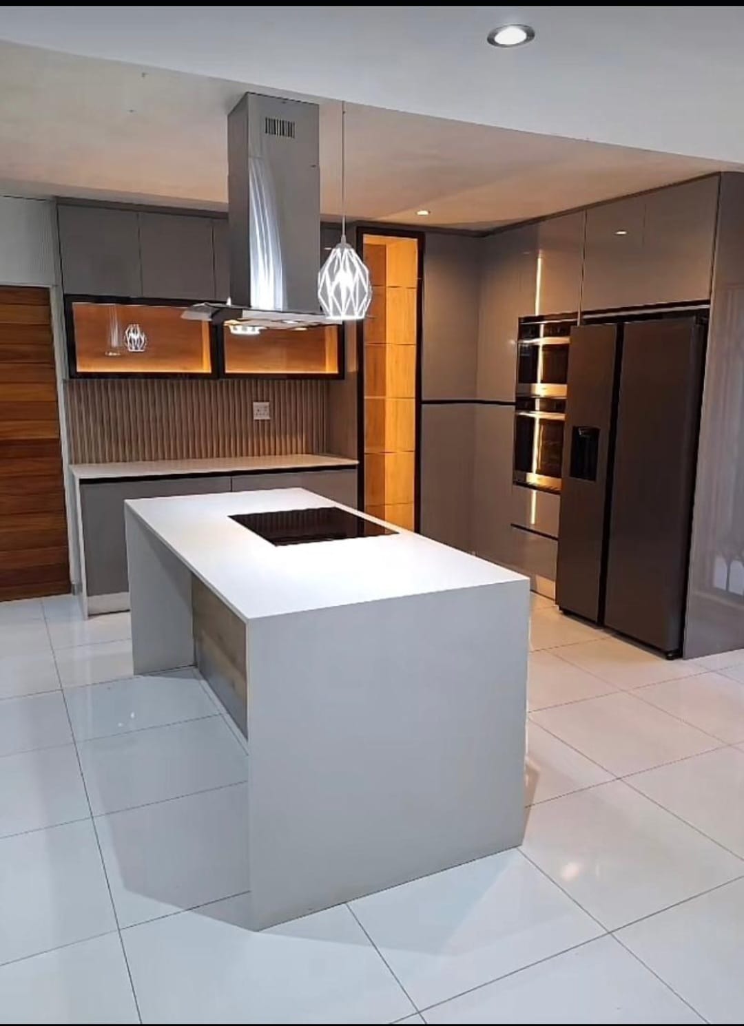 Industrial loft-style kitchen with dark cabinetry and steel accents installed in Johannesburg by Elite Wood Works